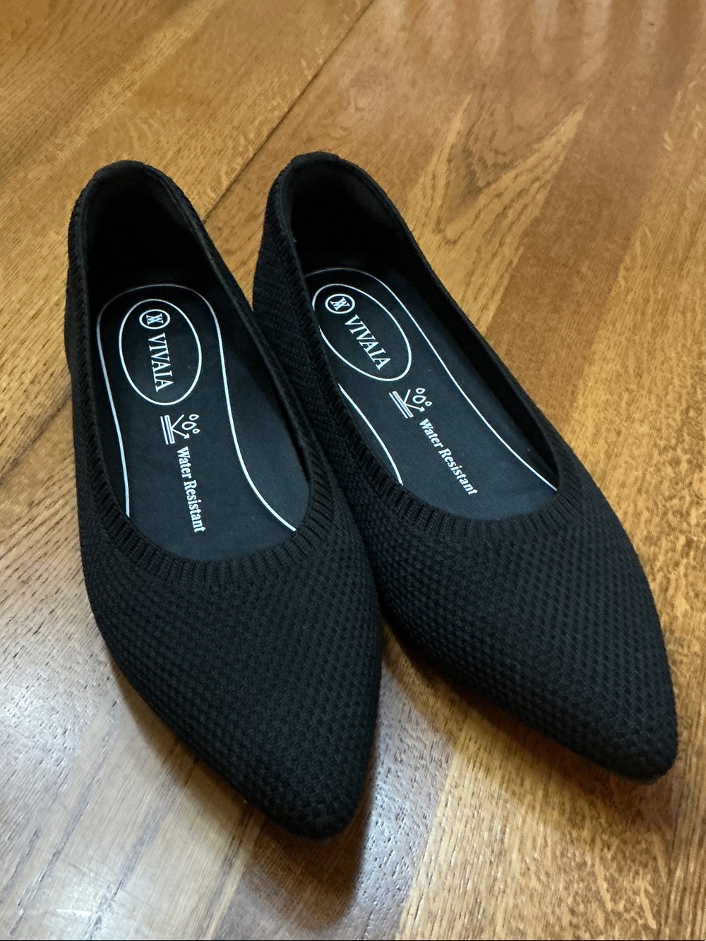Woman’s Vivaia black pointed toe water repellent ballet flats. Size 37. New!